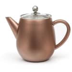 Elegant koperen theepot met glazen deksel en roestvrijstalen knop, ideaal voor het bereiden van thee in stijl. Perfect voor wie houdt van hoge kwaliteit keukenaccessoires.